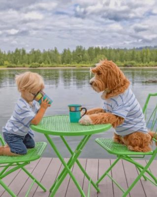 Boy Drinking Coffee With His Puppy Pa