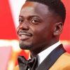 Classy English Actor Daniel Kaluuya Smiling By Diamond With Number