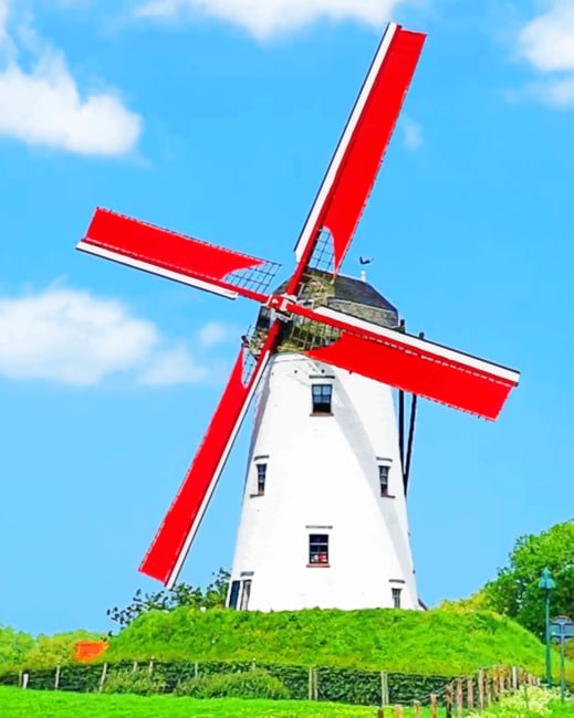 finalizing white windmill landscape painting